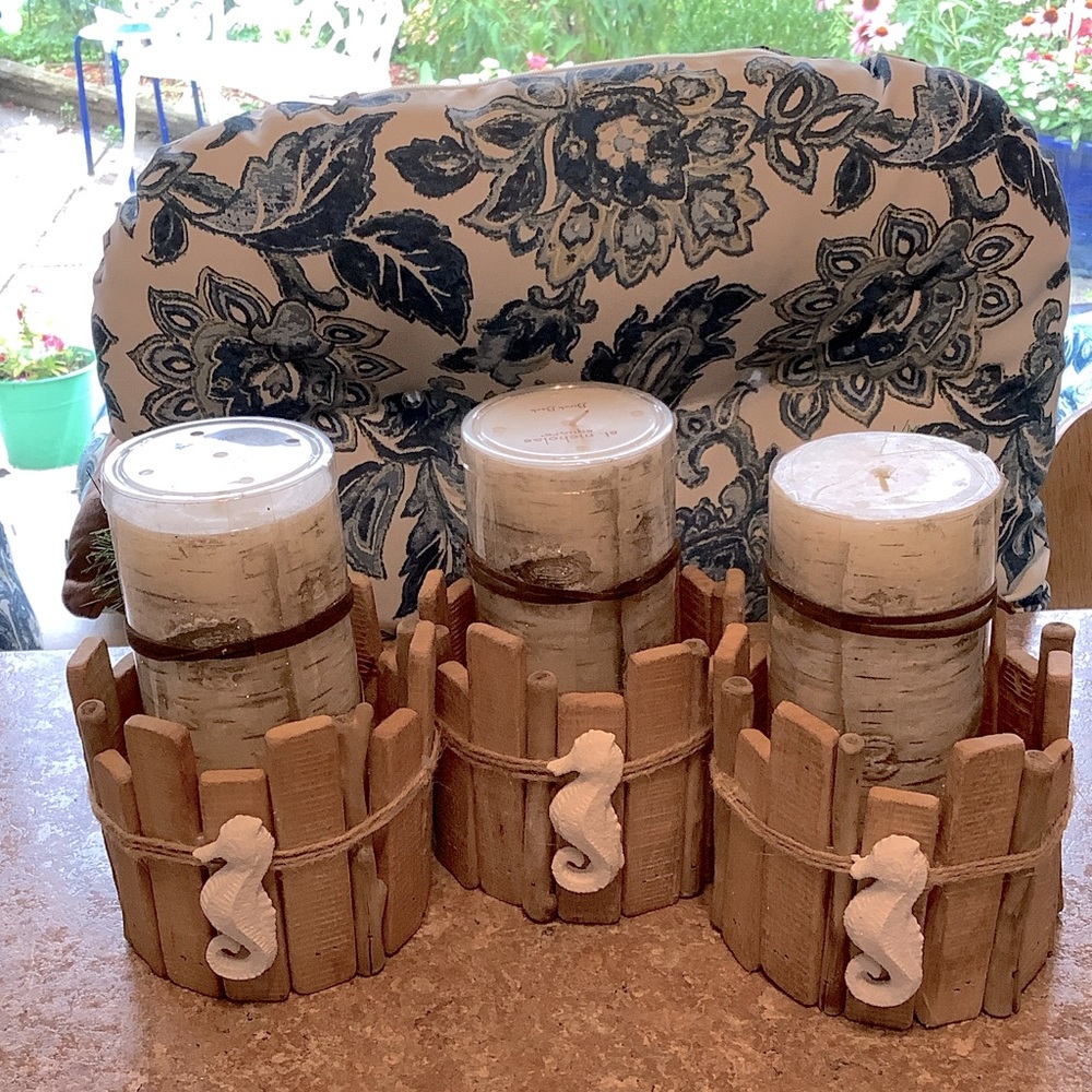 THREE WOOD SEA HORSE CANDLE HOLDERS.